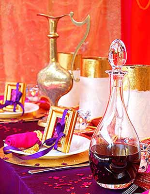 Arabic drinks and party table decorations in bright pirple golden and pink colors 