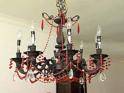  black chandelier with red beads and crystals in baroque interior style 