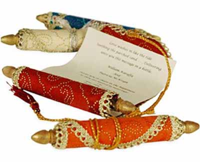 colorful red Orange invitations for Arabian Nights themed party rolled into Persian carpet style 