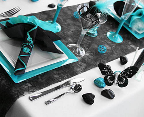 black butterfly hearts and decorative pebbles are unique table decorations