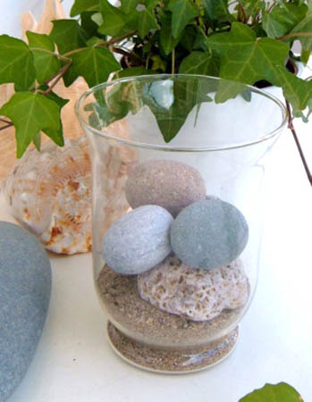 Party table decoration and heart ideas with beach pebbles