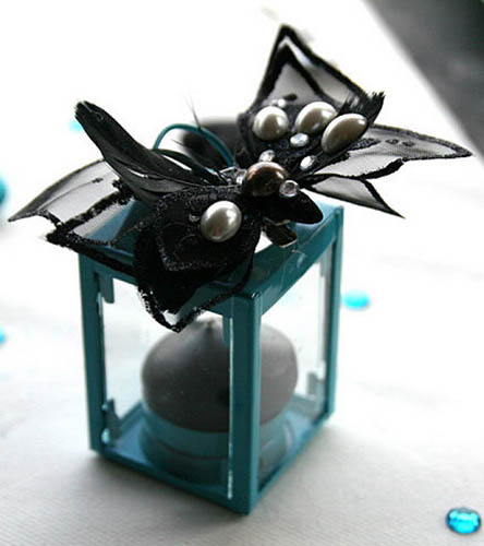 glass candle holder and table centerpiece ideas in black and turquoise colors