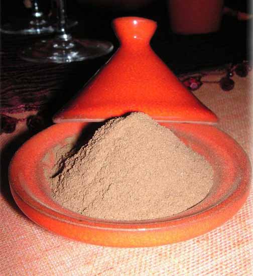 orange tableware with spices for moroccan style table decoration