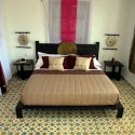 arabic bedroom decor with white and pink flowera and floor tyles in a traditional Moroccan style