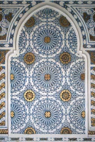 Moroccan tiles and painting in white and blue colors for wall decoration in the Moroccan-style