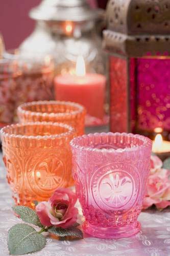 Orange and pink glass candle holder with tea light candles
