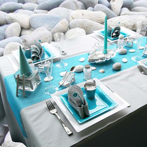 turquoise colors for table setting and beach stones on