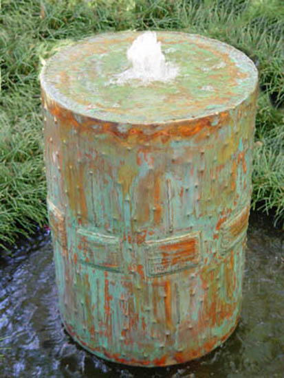 barrel water fountain is one of simple and cheap garden decorations