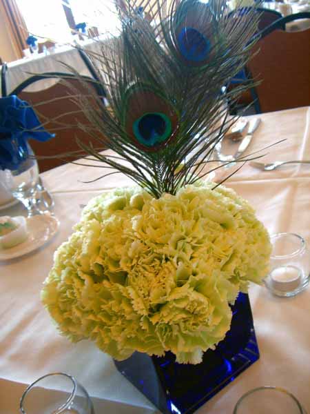 peacook feather decorations and yellow flowers centepiece ideas