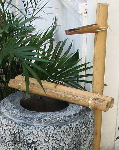 Japanese garden water features include a bamboo fountain