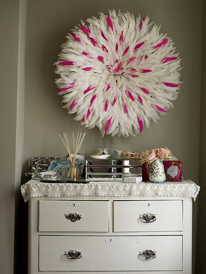 juju hats of white and pink feathers are modern wall decorations