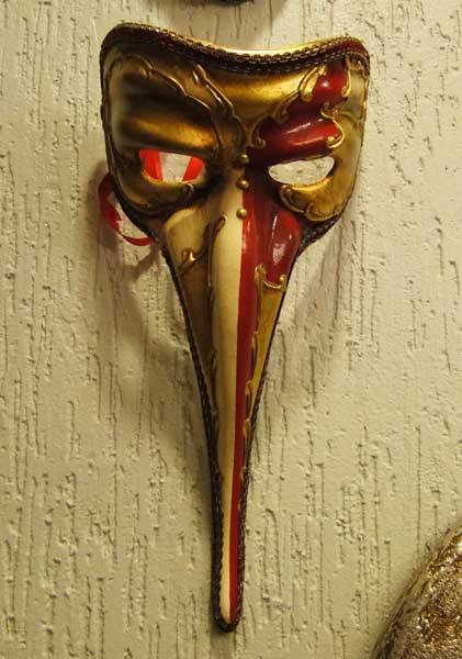 masquerade mask in gold and red colors for innovative wall decor ideas with Venetian masks