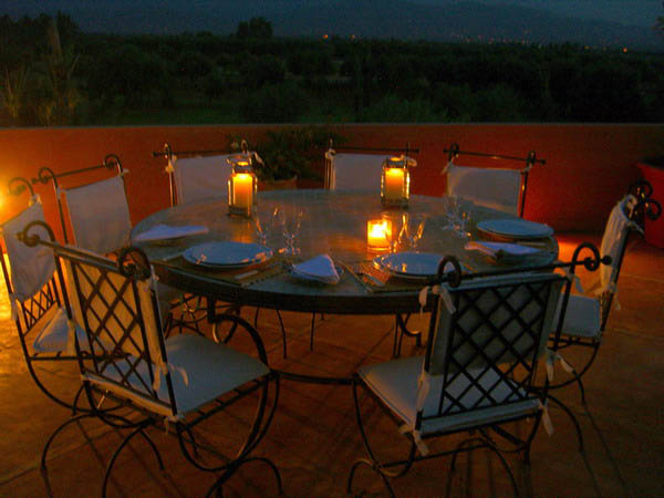 outdoor dining room decoration with candles