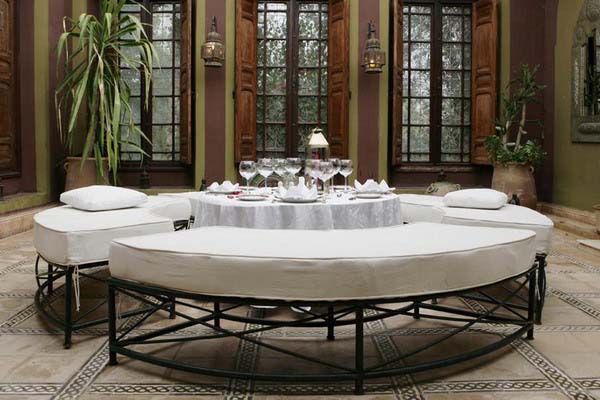 Moroccan style decoration for dining rooms with soft benches and white upholstery fabric