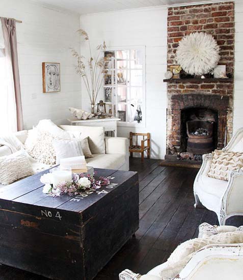 white juju hat on the wall over living room fireplace