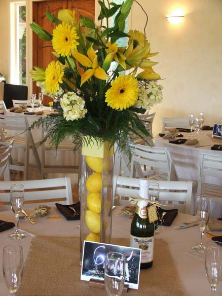 yellow pears and flowers are bright table decoration ideas