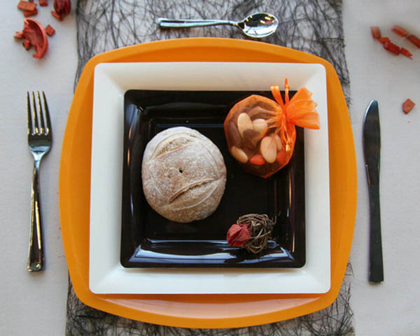 black and white with orange plates are halloween decoration ideas
