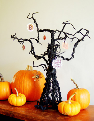 creative autumn crafts, Halloween decorations and ideas with black mini tree and orange pumpkins