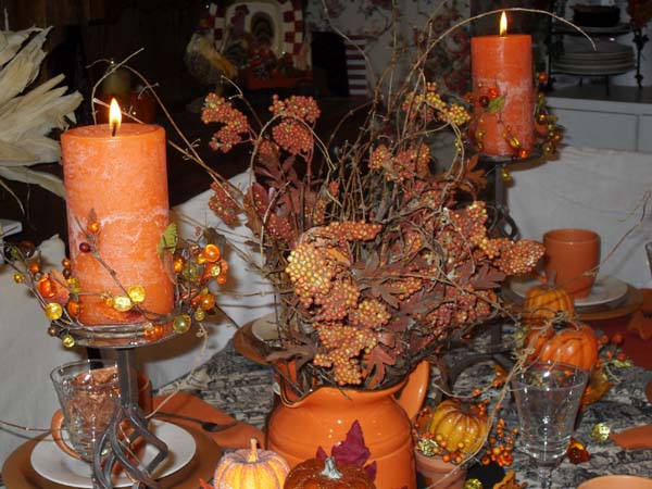 orange cendles centerpieces and btanches for thanksgiving decorating