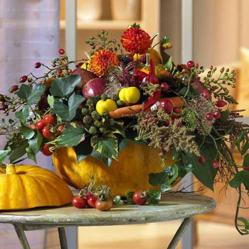 fall flowers and green leaves in Pumpkin Vase