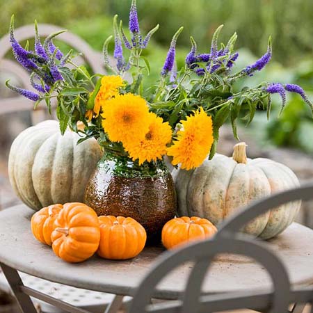 halloween decorating ideas with pumpkins and orange fall flowers