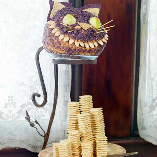 black cat is one of edible decorations for halloween party table