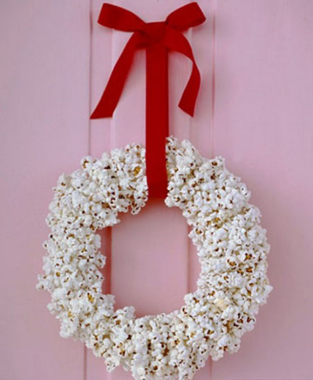Christmas Wreath makes popcorn and red tape