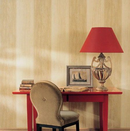 beige and cream striped wallpaper with red table and lampshade