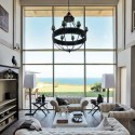 white living room furniture and antique chandelier