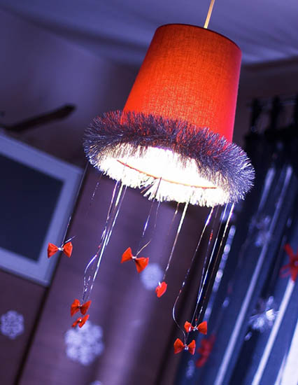 red ceiling lighting fixtures with homemade Christmas decorations