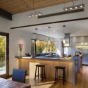 modern kitchen design with wood cabinets and dining