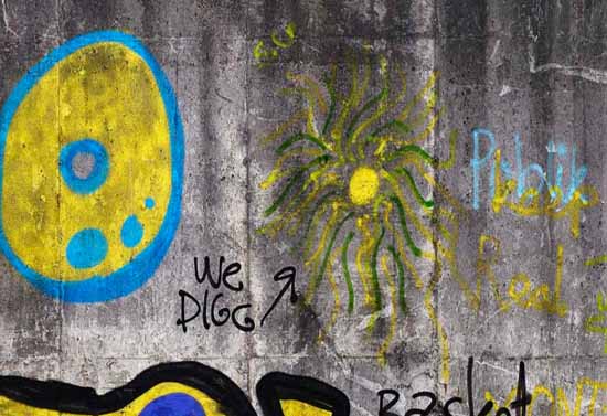 concrete wallpaper with graffiti on the wall