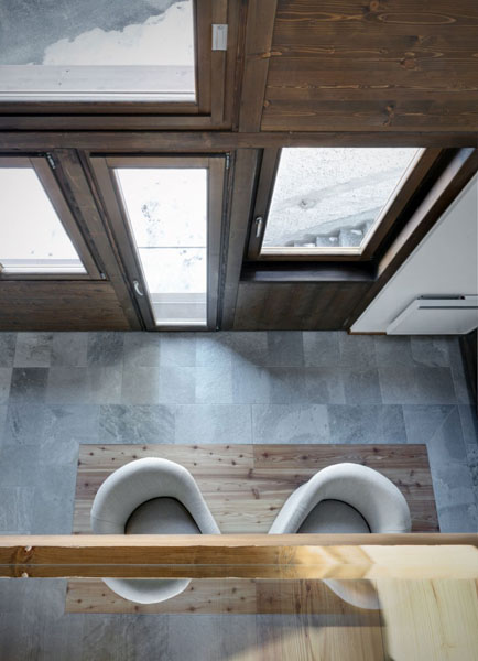 slate floor and large windows in entryway