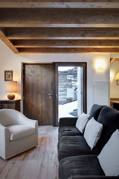 small living room with wooden beams on the ceiling