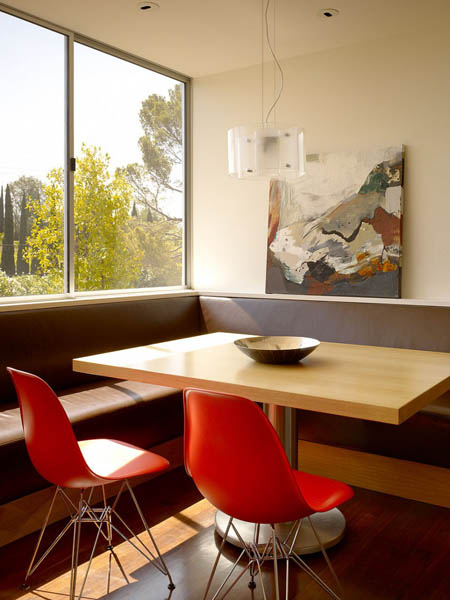 red dining chairs and wooden table