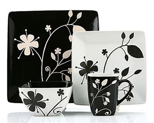 black and white decorative pillows and dishes