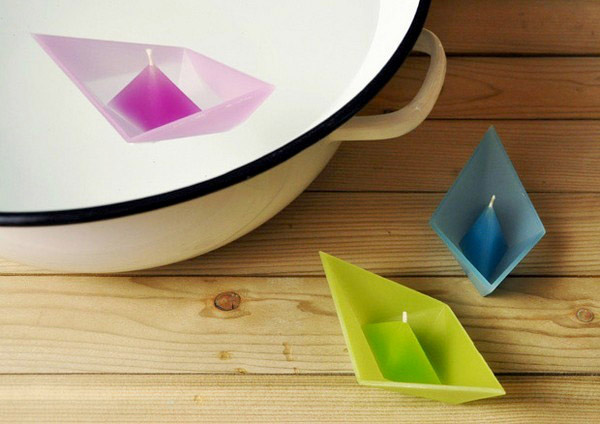 floating candles as paper boats shaped