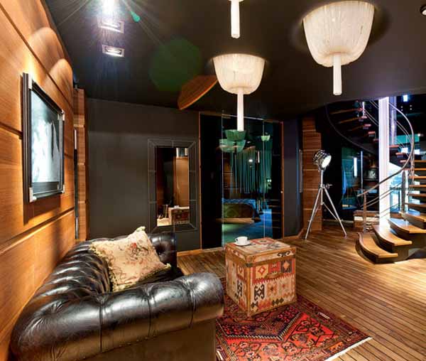 Penthouse Interior Decoration Ideas-mile facility (4)  black leather sofa and unique Ottoman