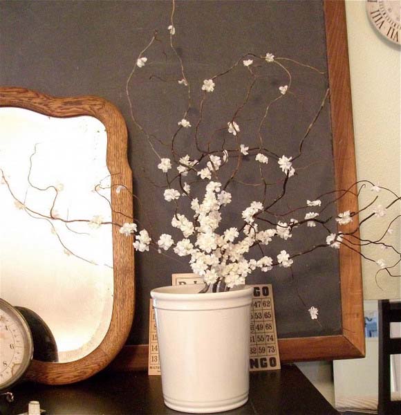 flowering branches in white vase