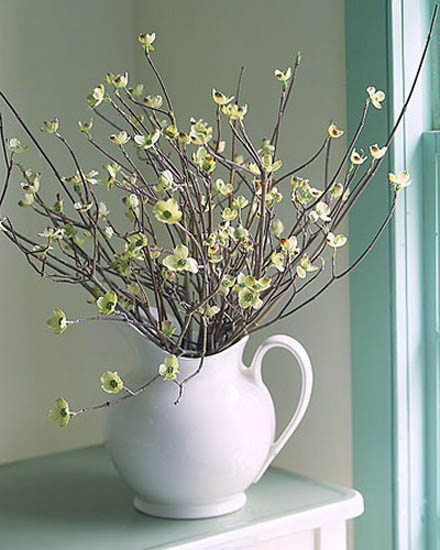 table centerpiece of flowering twigs