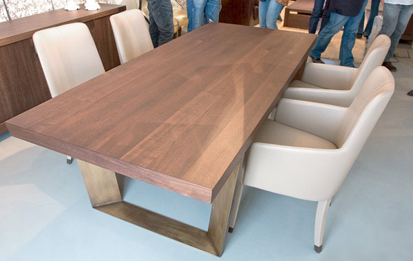 wood table and upholstered chairs in white
