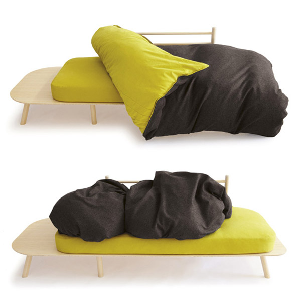 green and black quilt, the sofa makes back