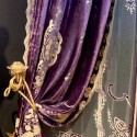 Purple curtains with golden embroidery and