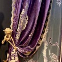 purple draperies with golden and embroidered details