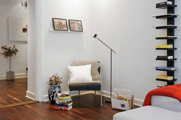  modern chair with a white cushion and stand lamp 