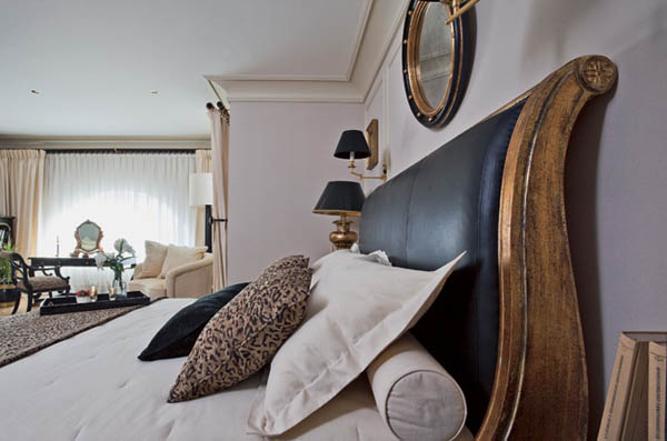 bedding in neutral colors, wood bed decorated with leather fabric