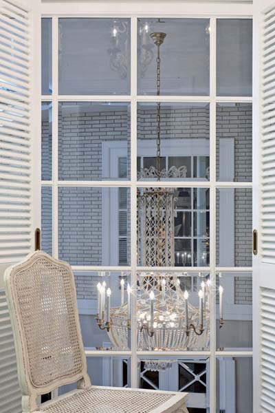 crystal chandelier and white furniture