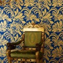 blue wallpaper with golden floral designs