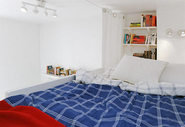 white bedroom with red accents