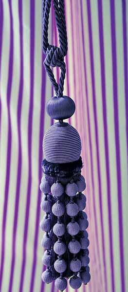 white and purple striped curtains and purple tassels